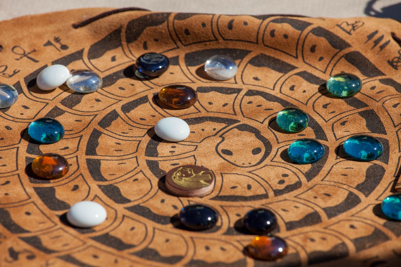The Art of Drawing Readers In: Your attractive post title goes here Close-up of a decorative board with colorful glass stones arranged on it.