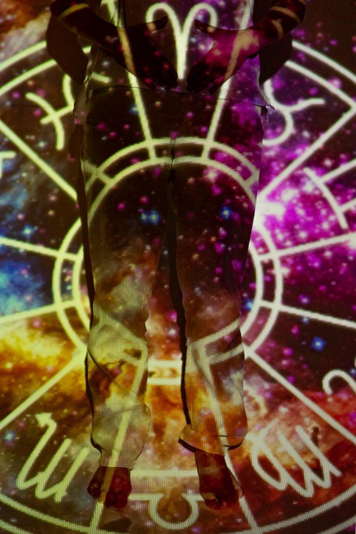 Mastering the First Impression: Your intriguing post title goes here A vivid astral background is projected onto a person's silhouette, creating a cosmic and mystic visual effect.